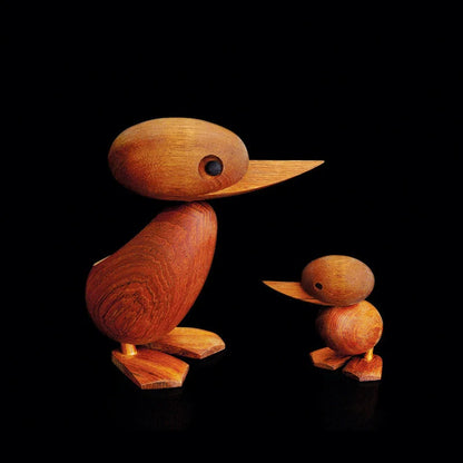 Handcrafted teak wood duck toy in duck yellow, available in large and small sizes