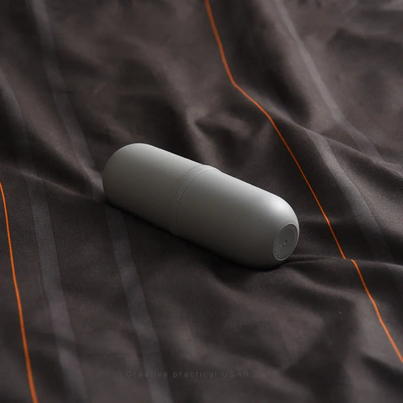 Capsule-shaped travel bottle in various colours with leak-proof design