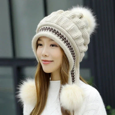 Knit fleece beanie with ear flaps and pompom in various colours for winter warmth