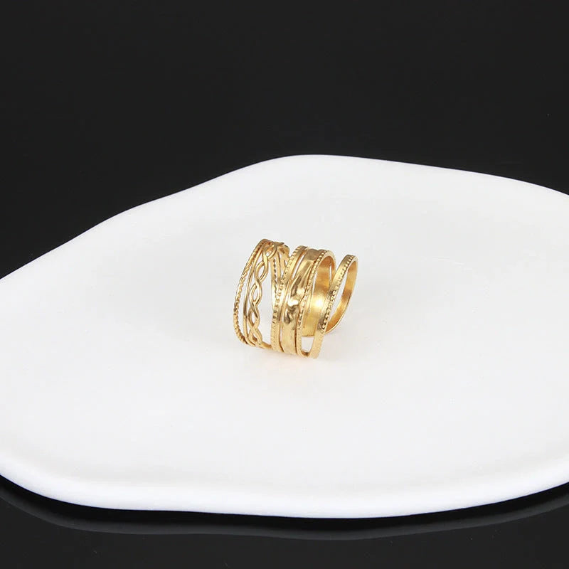 Adjustable stainless steel finger ring with unique charm designs