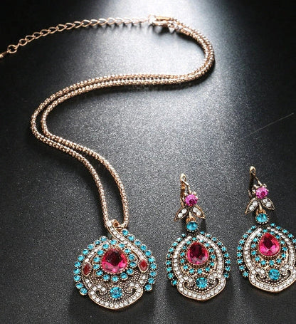 Elegant bohemian-style jewellery set featuring necklaces, earrings, and rings in a variety of colours and sizes