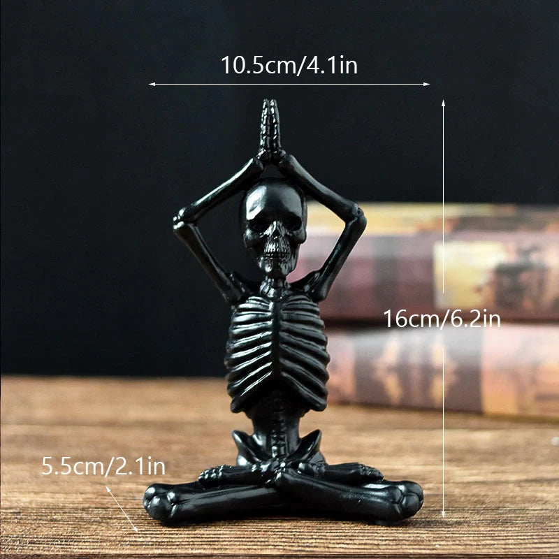 Haunting Halloween desktop ornaments, featuring intricate resin skulls and skeletons in black and vintage white finishes