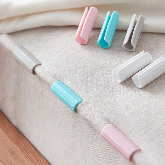 Non-slip sheet fixing clips in various colours for securing bedding and cushions