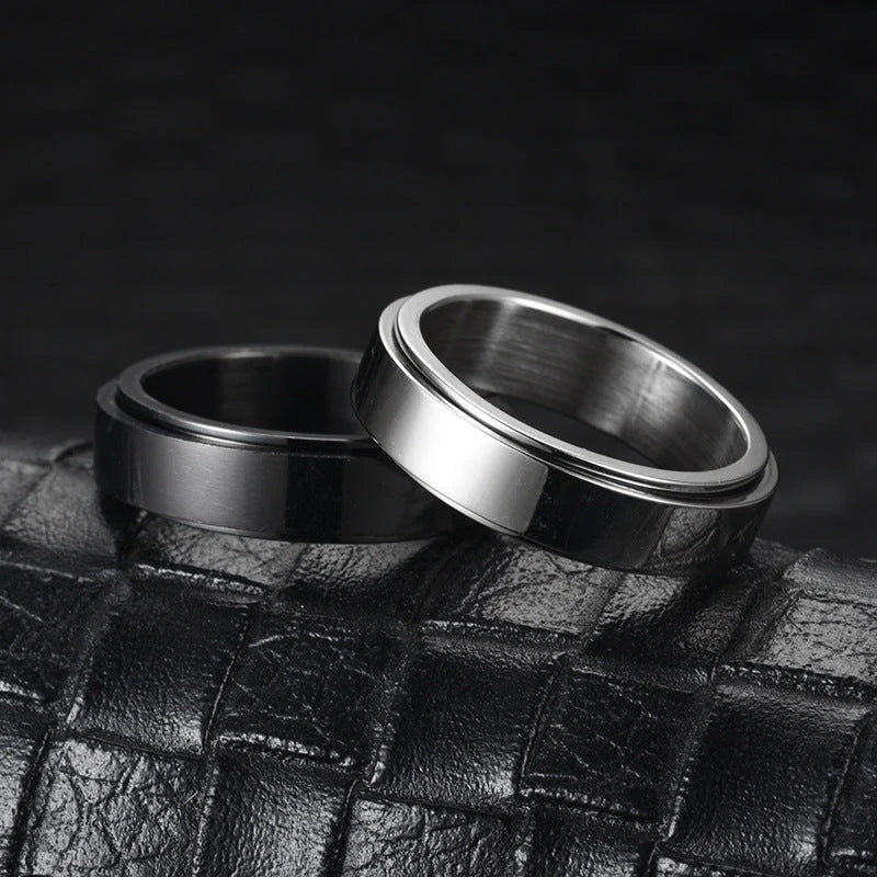 Elegant stainless steel spinner ring with a captivating moon and star design that rotates effortlessly for a calming tactile experience