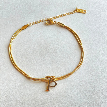 Personalised gold and silver love knot bracelets for couples, perfect as Valentine's Day gifts.