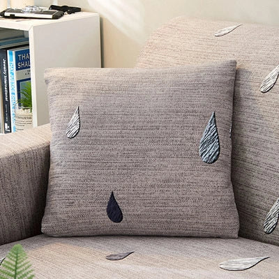 Stretchable geometric print sofa cover on a three-seater sofa