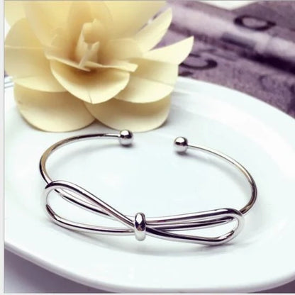 Elegant knotted O-type metal openwork bracelet in various colours
