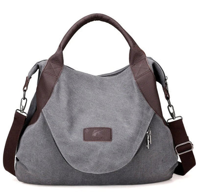 Stylish and versatile canvas shoulder bag with premium brass hardware and thoughtful interior organisation