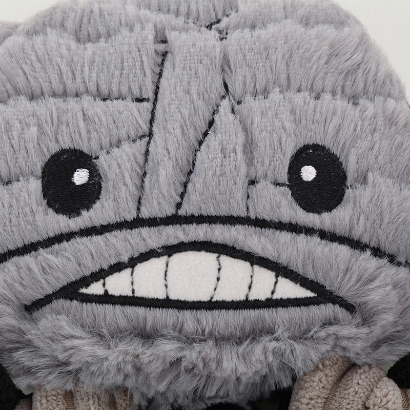 Halloween-themed plush dog toys with squeak features in grey, orange, and green