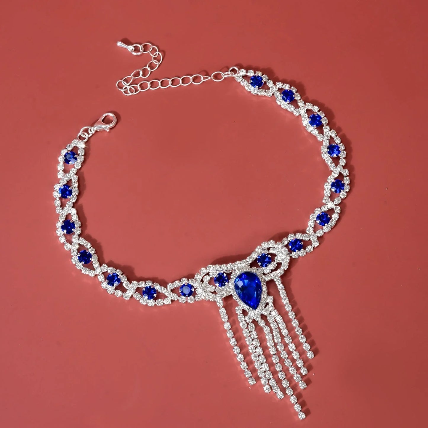 Elegant blue rhinestone tassel anklet for women, perfect for adding glamour to any outfit.