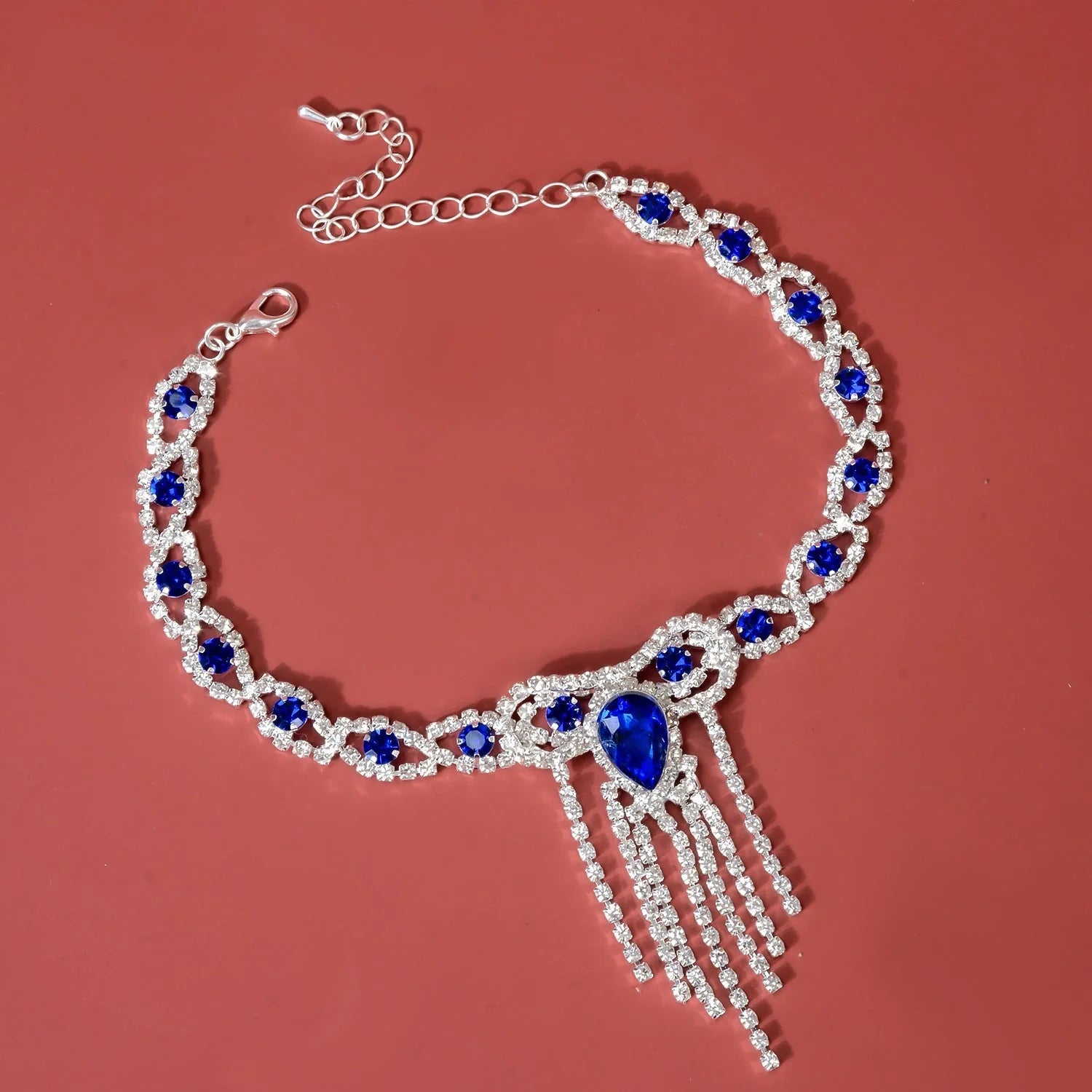 Elegant blue rhinestone tassel anklet for women, perfect for adding glamour to any outfit.