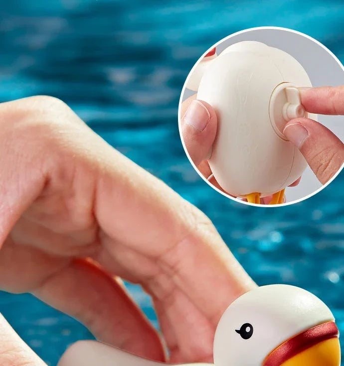 Charming wind-up bath toys featuring a goose and dolphin design, made of durable ABS plastic for safe and fun water play