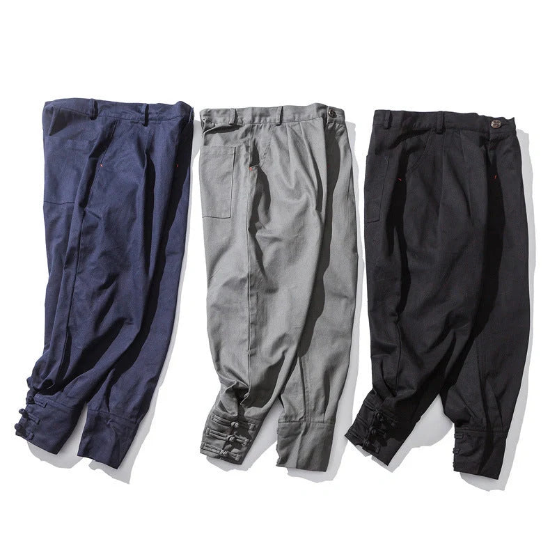 Men's cotton blend casual trousers with button placket in black, blue, and grey