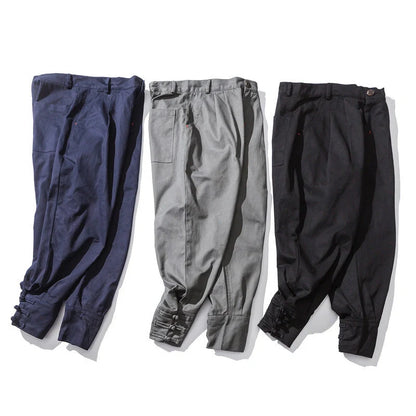 Men's cotton blend casual trousers with button placket in black, blue, and grey