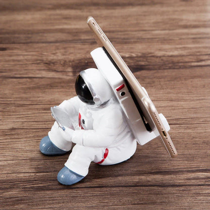 Charming astronaut-themed mobile phone stand made of high-quality resin, designed to securely hold your phone on your desk or workspace