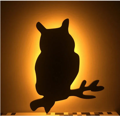 A stylish cat-shaped smart sensor night light that automatically illuminates a room when motion is detected, creating a warm and cozy atmosphere.