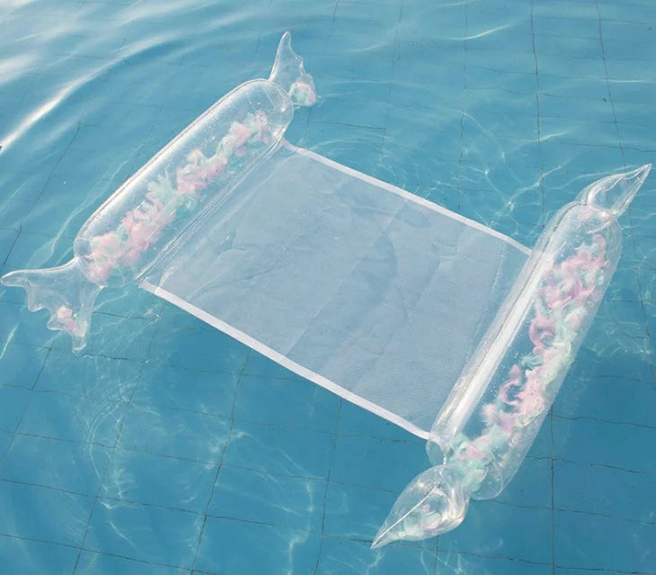Inflatable water lounge chair in blue, floating in pool with hammock-style design