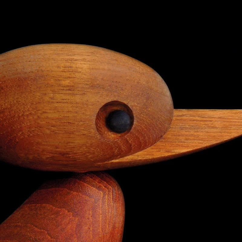 Handcrafted teak wood duck toy in duck yellow, available in large and small sizes