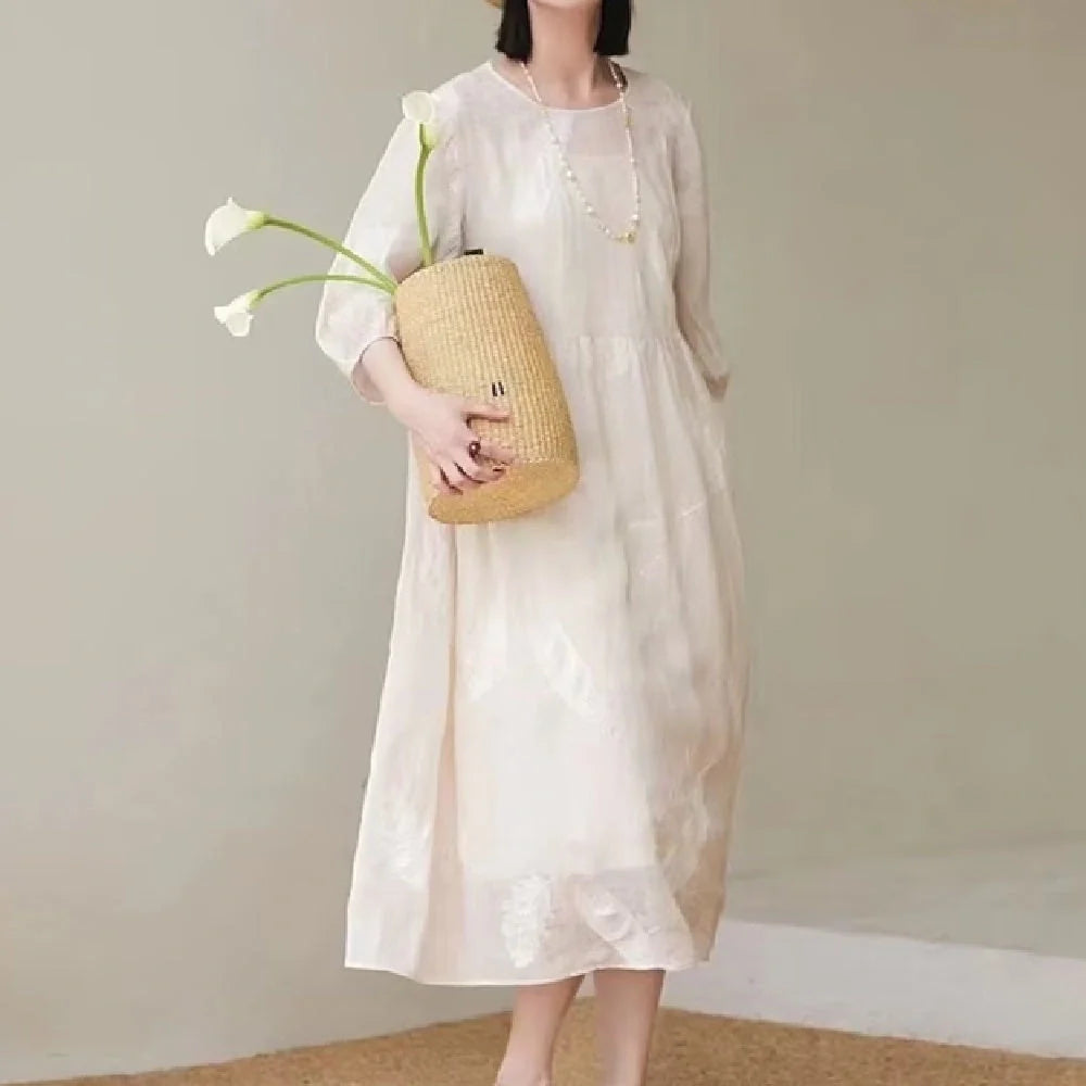Women's white linen dress with relaxed fit, perfect for summer