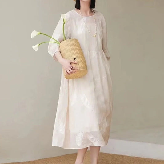 Women's white linen dress with relaxed fit, perfect for summer