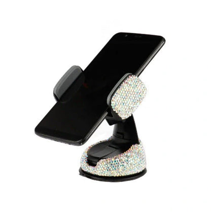 Diamond-encrusted car phone holder mounted on air vent with phone securely in place