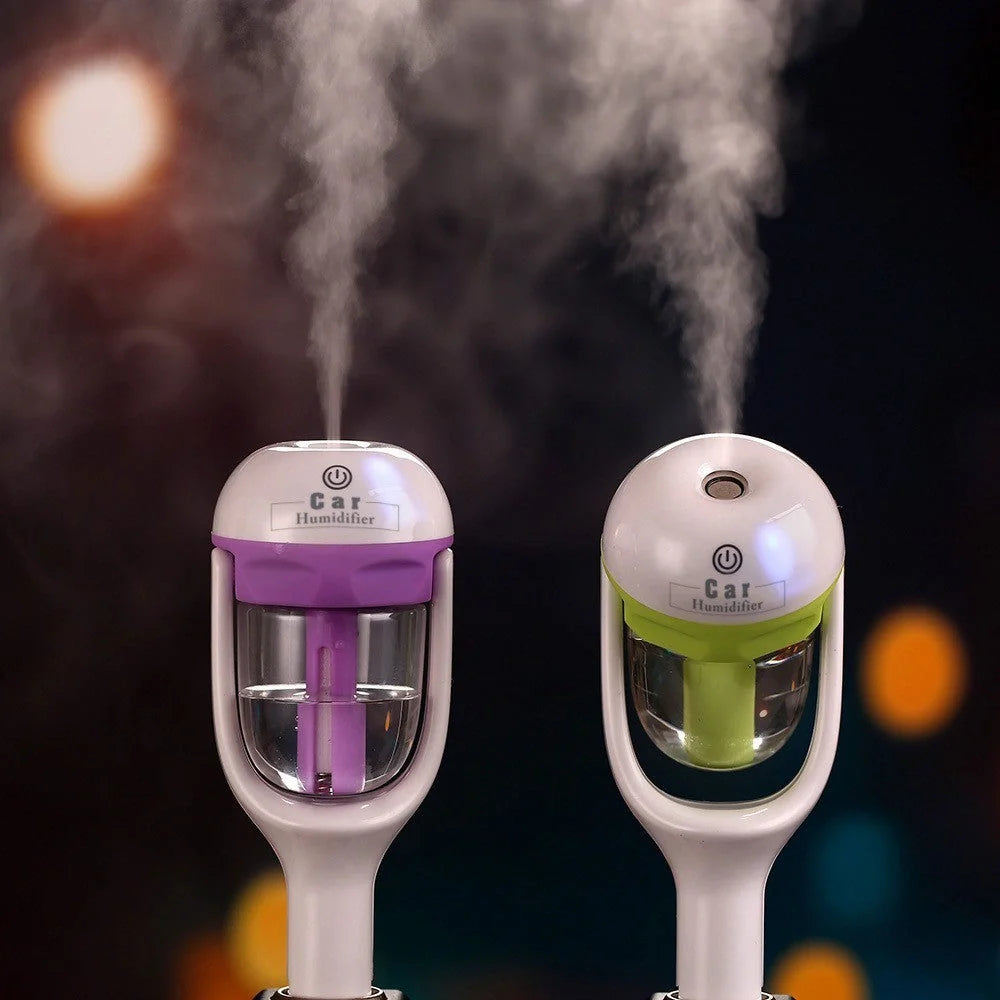 Mini 12V car steam humidifier with aroma diffuser and air purifier in blue, green, pink, and purple