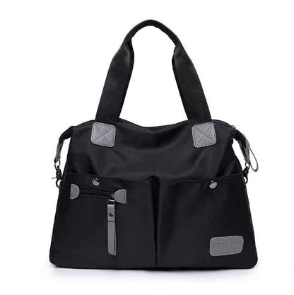 Versatile ladies shoulder bag with multiple carry options, numerous pockets, and durable Oxford fabric construction