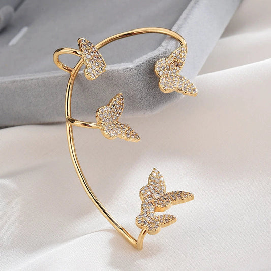 Sparkling butterfly-shaped ear cuffs with zirconia stones, available in gold and silver alloy finishes