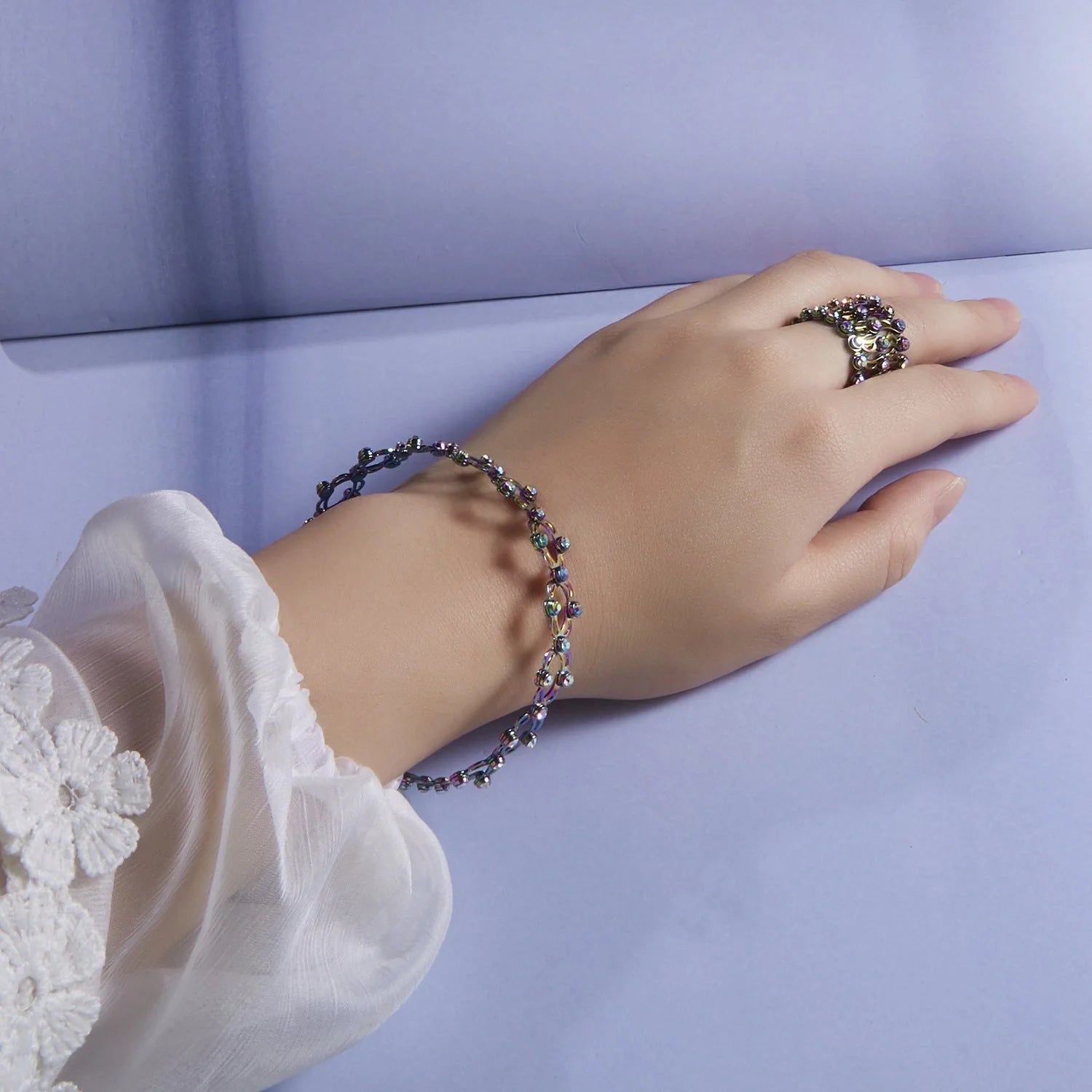 2-in-1 folding retractable rings bracelet with rhinestone detail, adjustable design