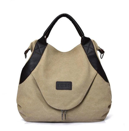 Stylish and versatile canvas shoulder bag with premium brass hardware and thoughtful interior organisation