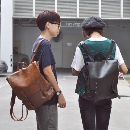 Durable PU leather backpack with spacious storage and laptop compartment for modern men