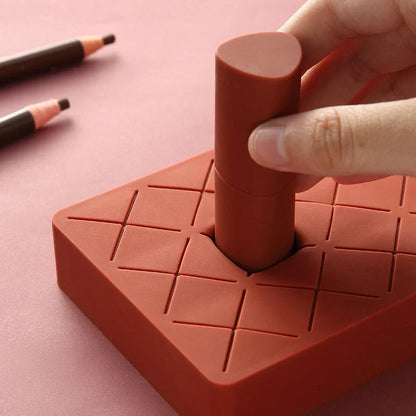 Silicone and ABS lipstick storage rack in red, pink, blue, and grey
