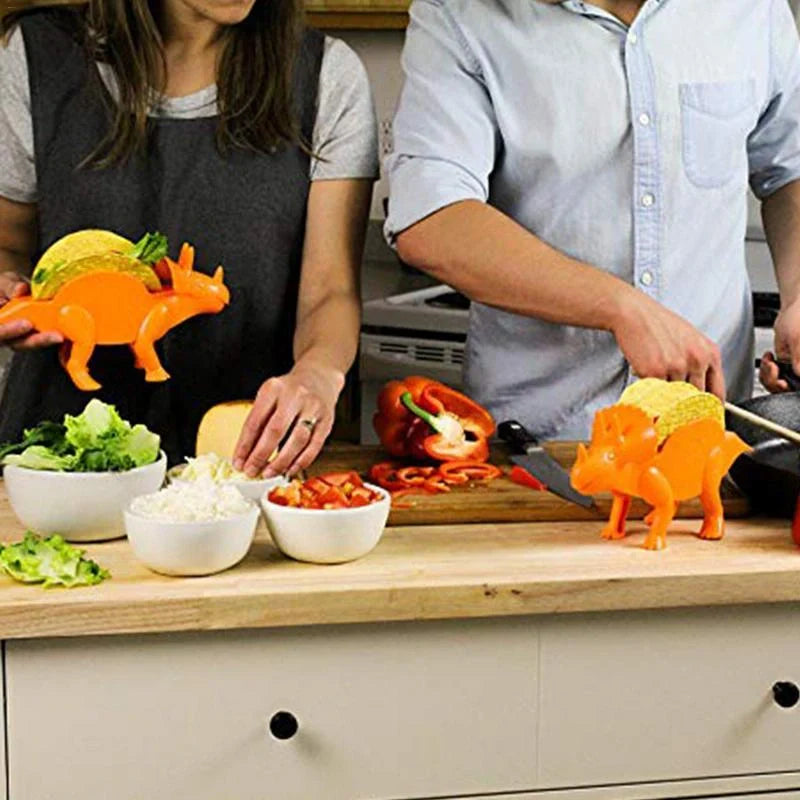 Dinosaur-shaped plastic taco holder in green, pink, or army green