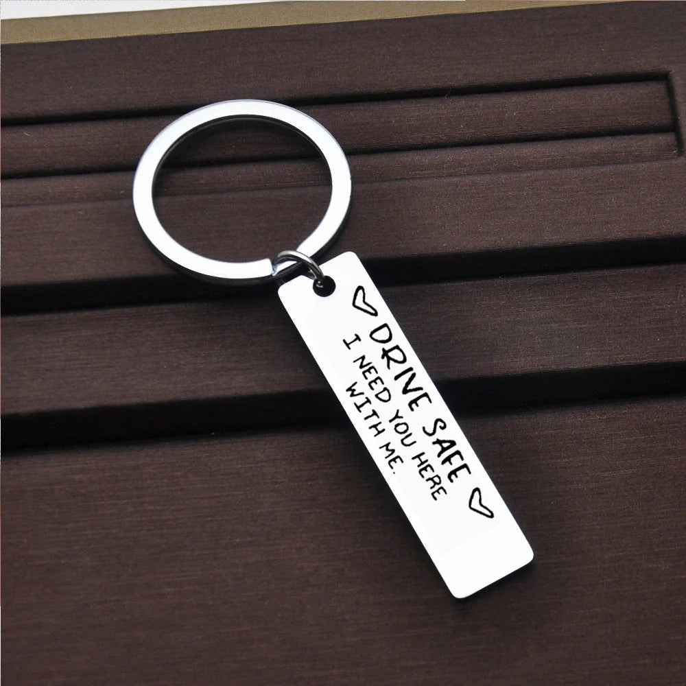 Stainless steel keychain with 'Be Safe Honey I Need You Here With Me' engraving