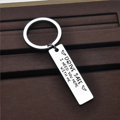 Stainless steel keychain with 'Be Safe Honey I Need You Here With Me' engraving
