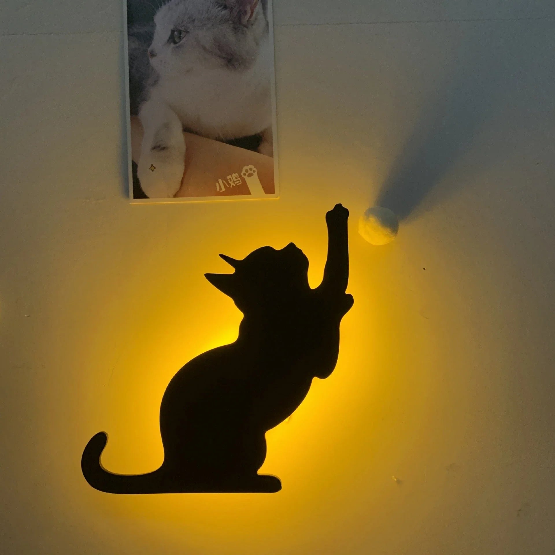 A stylish cat-shaped smart sensor night light that automatically illuminates a room when motion is detected, creating a warm and cozy atmosphere.