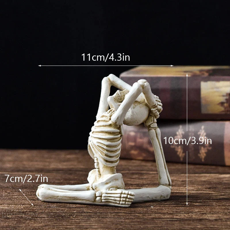 Haunting Halloween desktop ornaments, featuring intricate resin skulls and skeletons in black and vintage white finishes