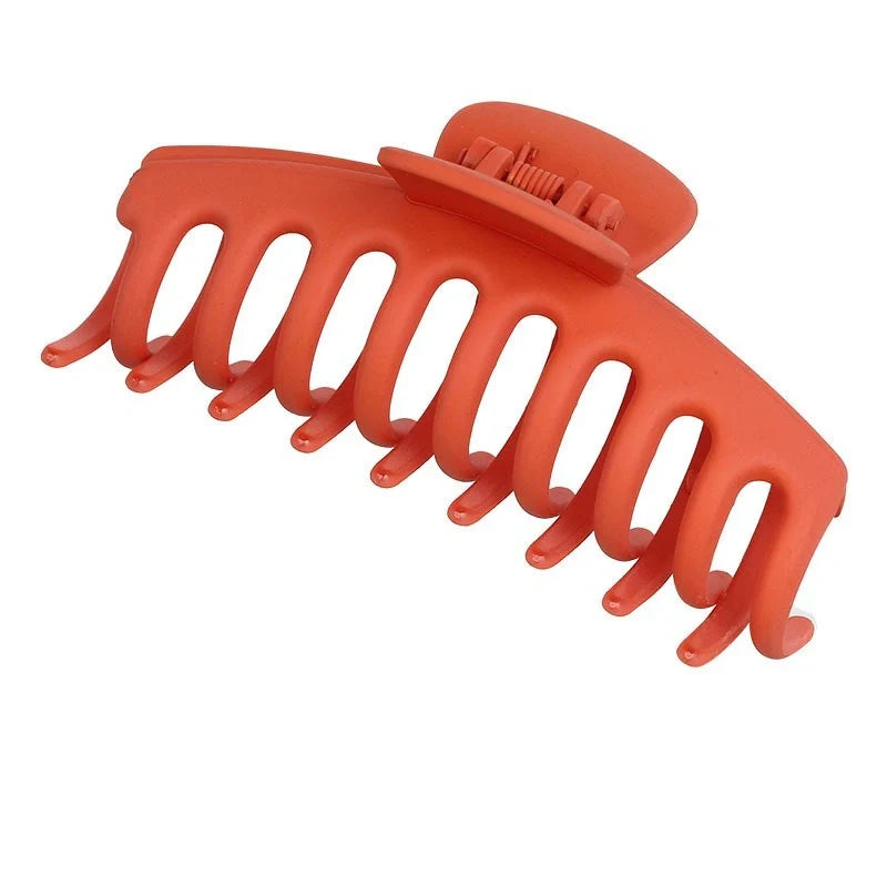 Candy-coloured plastic ponytail clip for showers and daily hair styling