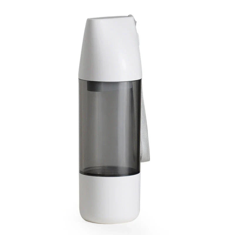 Portable pet water bottle with food container compartment, made of durable ABS plastic and silicone for outdoor use