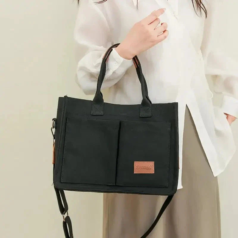 Stylish and durable canvas tote bag with multiple pockets for everyday use