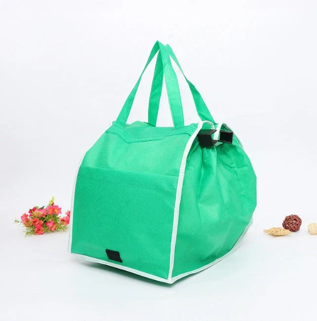 Reusable eco-friendly folding shopper bag in green colour, with generous front pocket and durable, mold-resistant construction