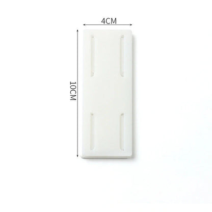 Self-adhesive wall hook in green, blue, white, and pink for cable organisation