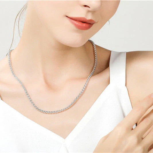 Silver-plated round pendant necklace with secure clasp, showcasing elegant British-inspired design