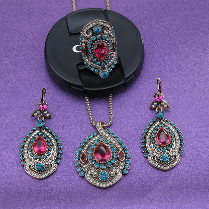 Elegant bohemian-style jewellery set featuring necklaces, earrings, and rings in a variety of colours and sizes