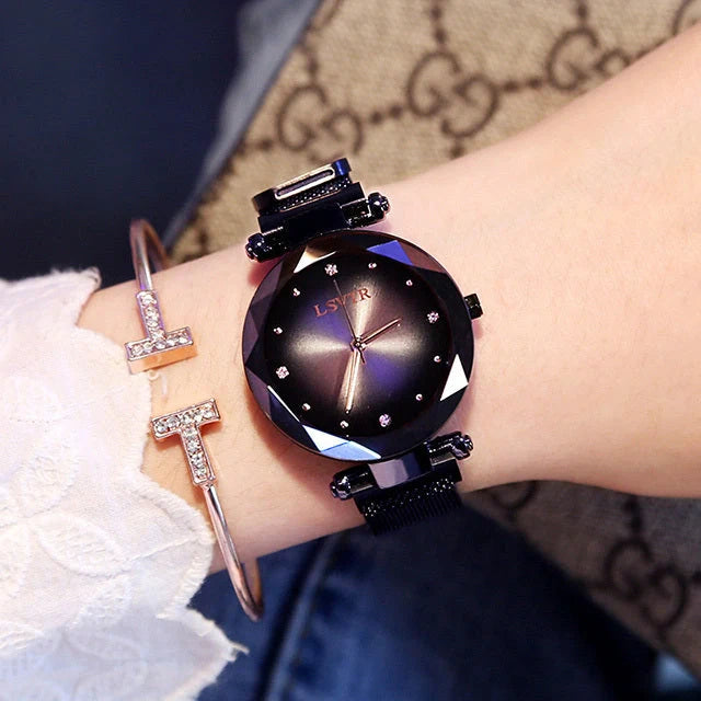 Elegant rose gold ladies' watch with diamond accents on a magnet strap