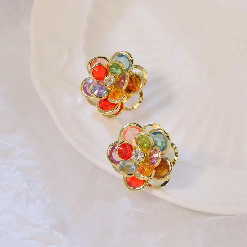 Small flower stud earrings for women in colour, black, and white options - sweet and trendy design