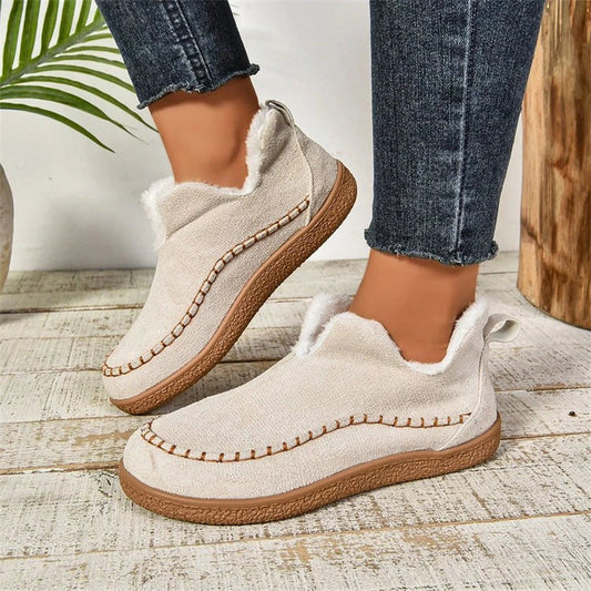 Stylish plush ankle boots with V-cut design, available in dark grey, black, light brown, and milky white colors