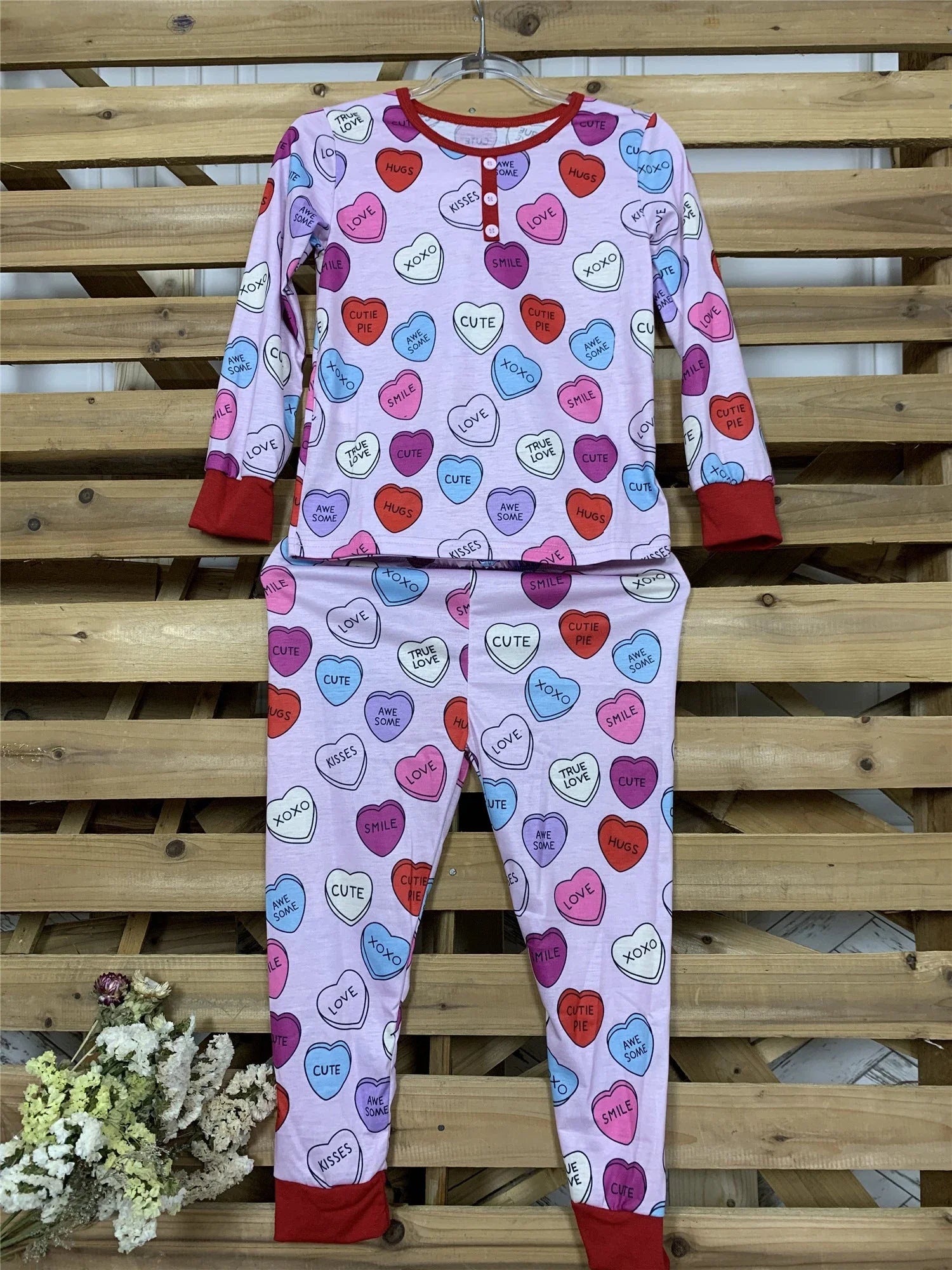 Cozy family matching Valentine's Day pajamas in soft cotton with heart print design