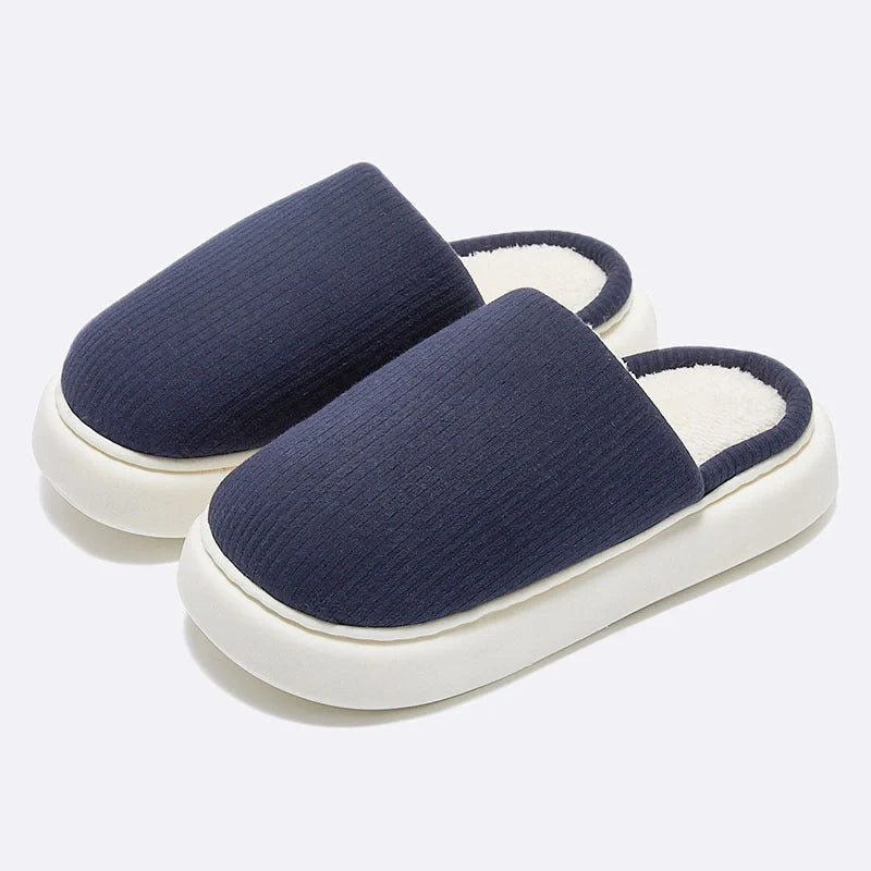 Cosy knitted fabric slippers in various colours and sizes, designed for couples to enjoy comfortable indoor relaxation.