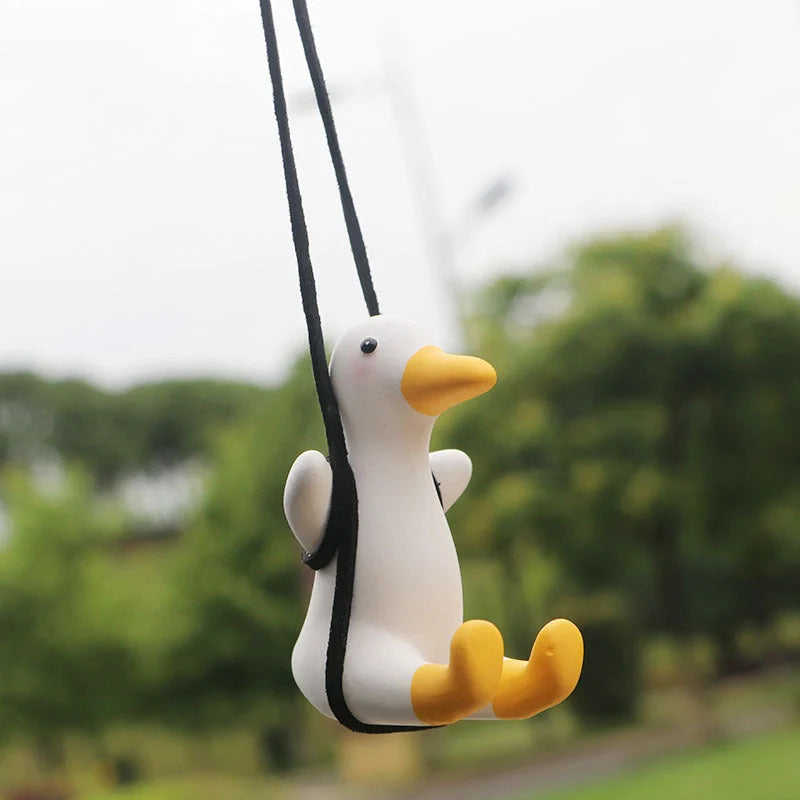 Car Swing Duck Ornament hanging from rearview mirror